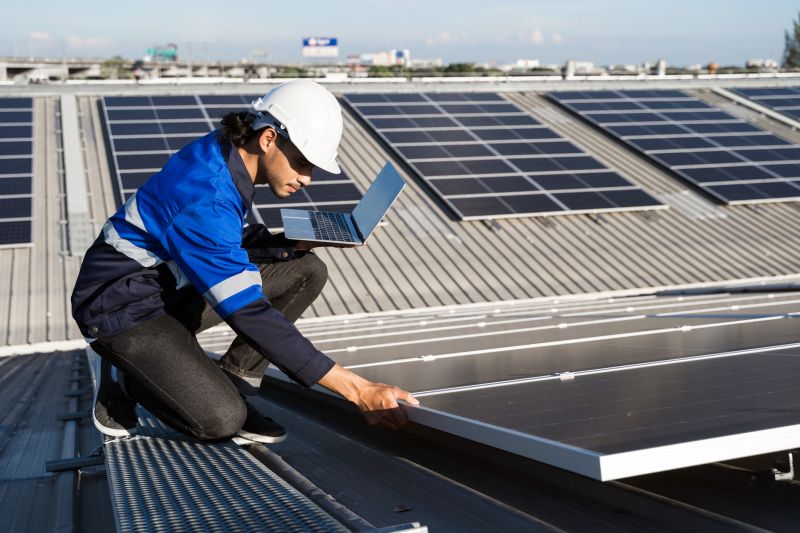 Technician Working on Solar Panels